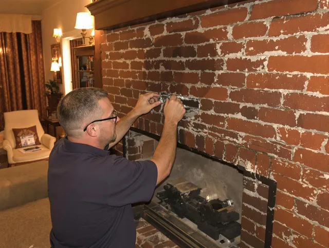 San Gabriel Chimney Sweep expert fixing a fireplace in San Gabriel, CA